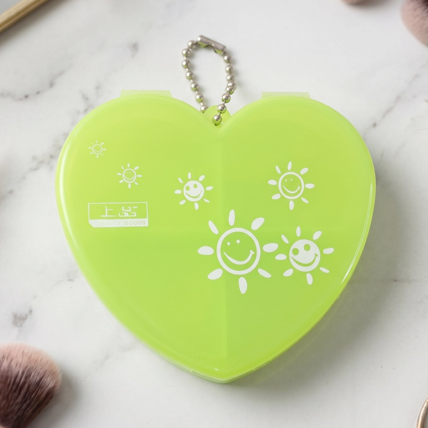Pill organizer attached to a keychain for travel